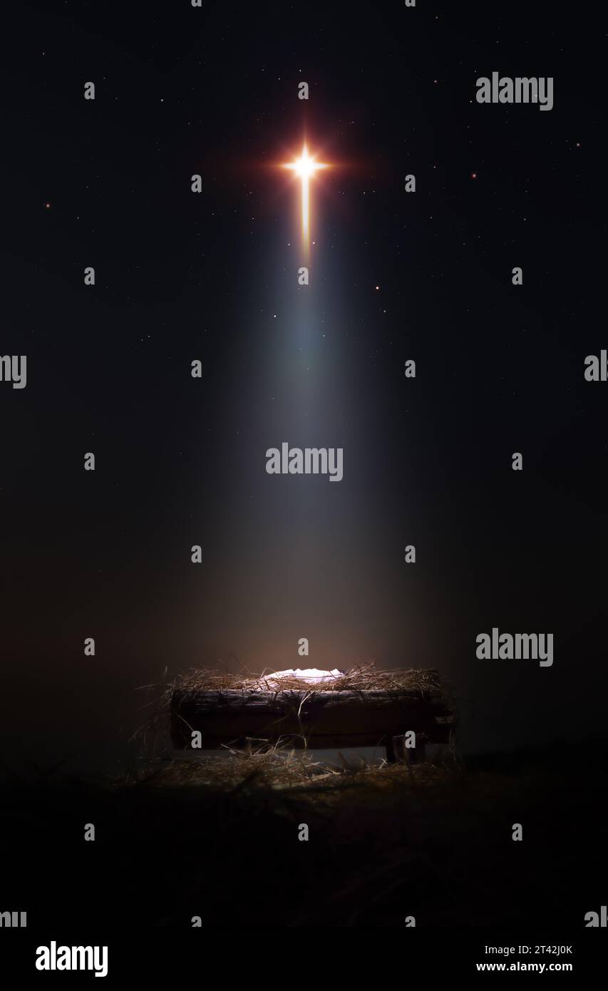 Ein großer Stern beleuchtet die Geburt des Jesuskindes in einer Krippe, ein Hintergrund, der Weihnachten feiert und auf seinen Tod am Kreuz anspielt. Stockfoto