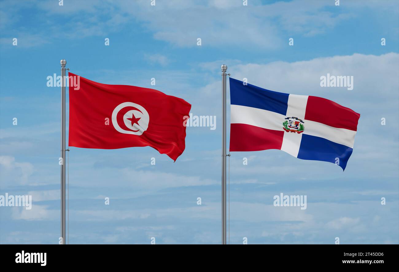 Die Fahnen der Dominikanischen Republik und Tunesiens schwenken zusammen auf blauem bewölktem Himmel, zwei Länder-Beziehungskonzept Stockfoto
