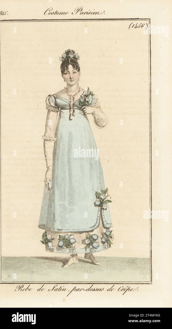 Modische Frau in Satin-Kleid mit Krepp-Tunika, verziert mit Blumen. Robe de Satin, par-dessus de Crepe. Handkolorierter Kupferstich von Jean Charles Baquoy nach einem Modeteller von Horace Vernet aus Pierre de la Mesangere’s Journal des Dames et des Modes, Magazine of Women and Fashion, Paris, 1815. Stockfoto