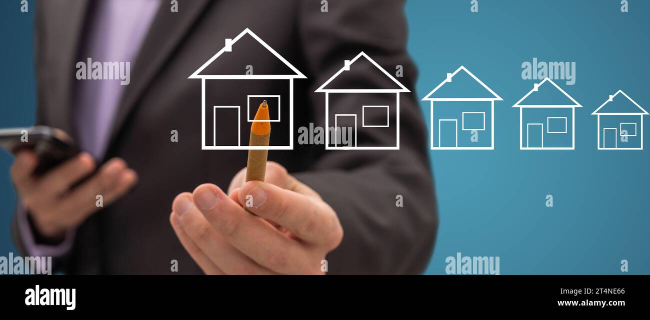 Geschäftsmann zeichnet ein Haus Stockfoto