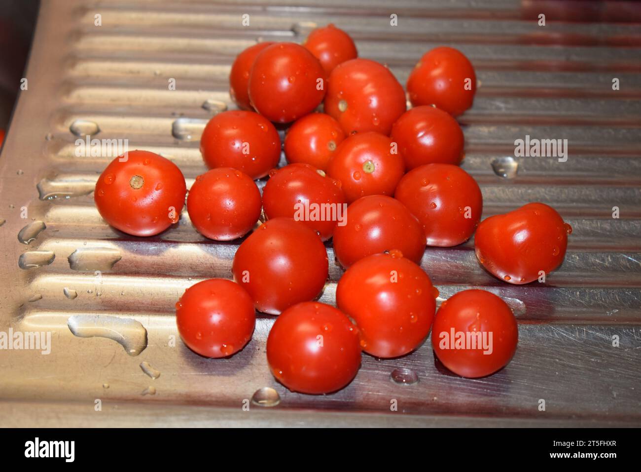 Nassen roten Tomaten Stockfoto