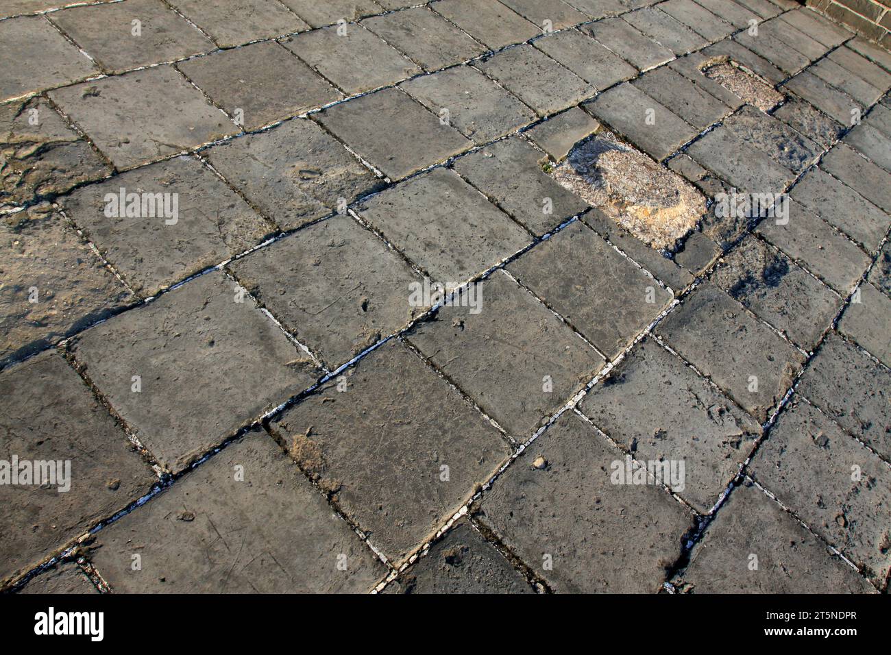 Graue Steine legen den Boden, Nahaufnahme des Fotos Stockfoto