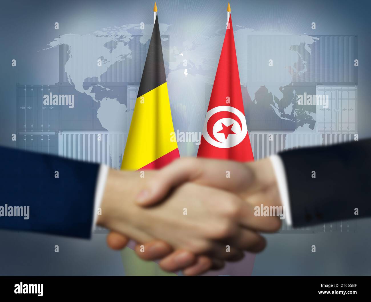 Zwei Menschen schütteln sich die Hände vor Belgien und Tunesien Stockfoto