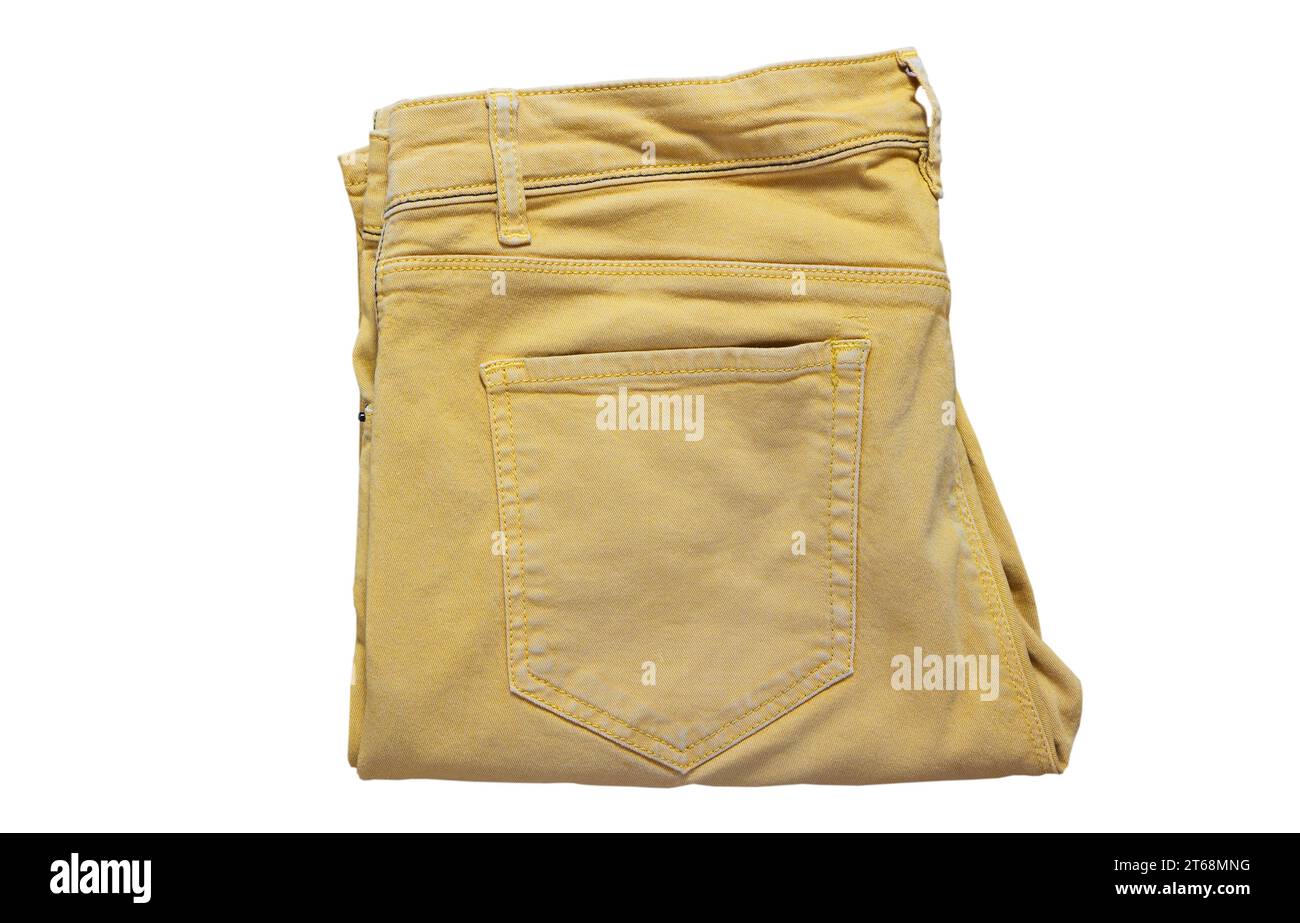 Gelbe Hosen isoliert, gelbe Jeans Hosen Hosen, enge Hosen. Moderne gelbe Hosen mit Taschen für Teenager isoliert auf weißem Hintergrund. Jugend Stockfoto