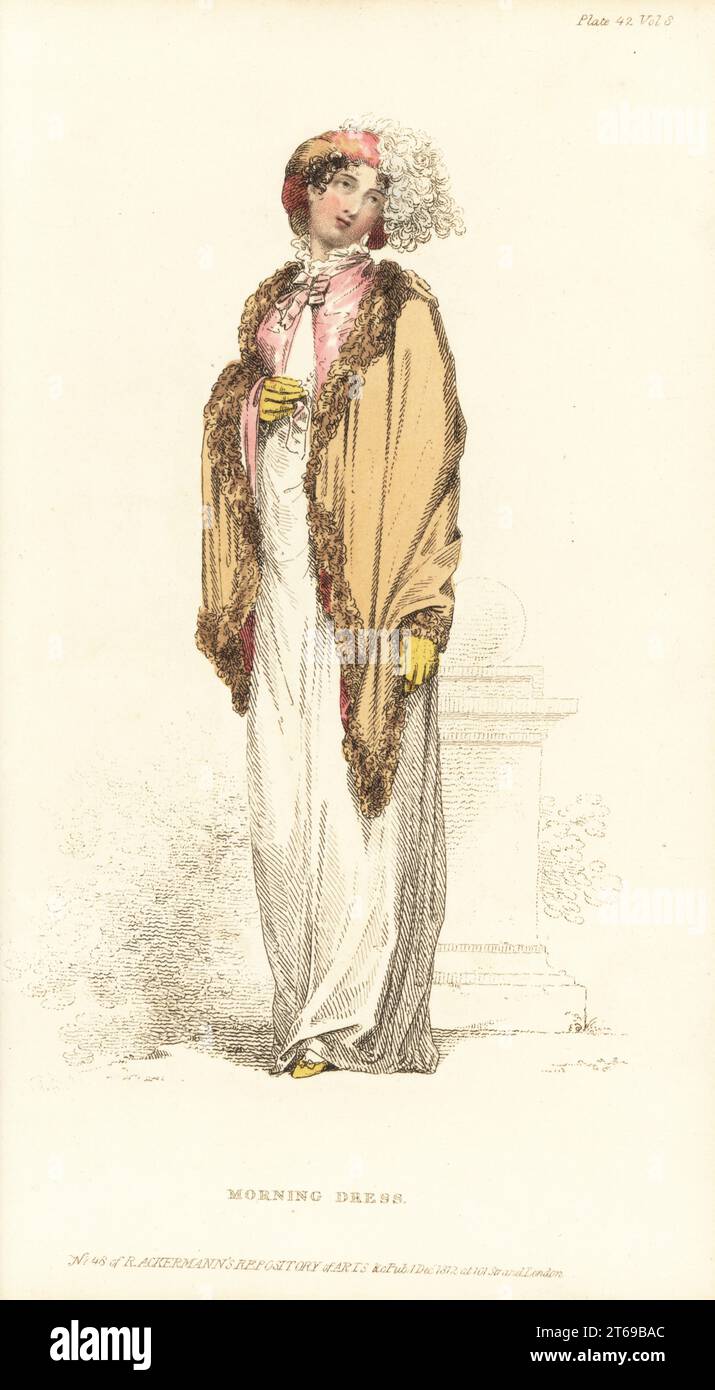 Regency Frau am Morgen oder Kutschenkostüm. Weißer Kambrikmantel, Rüschenkragen, russischer Mantel aus Samt, Traveller's Hut mit Straußenfedern, griechische Hausschuhe, Zitronen-Kinderhandschuhe. Plate 42, Vol. 8, Dezember 1 1812. Handkolorierter Kupferstich von Thomas Uwins aus Rudolph Ackermanns Repository of Arts, London. Stockfoto