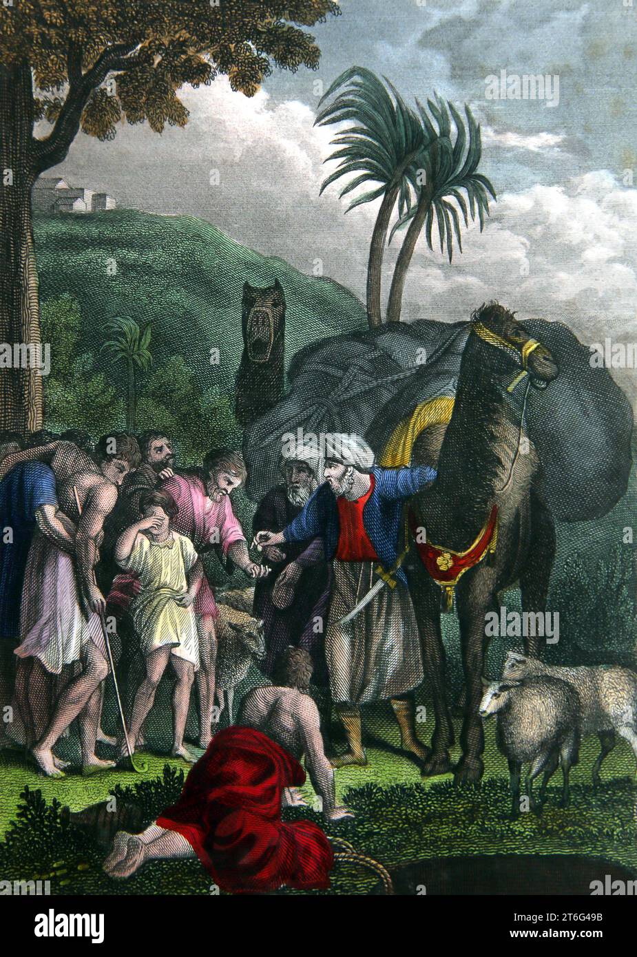 Joseph wird von seinen Brüdern an die Ismeeliten verkauft (Genesis) aus der selbstinterpretierenden Familienbibel Stockfoto