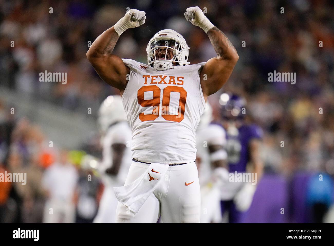 Texas defensive lineman Byron Murphy II reacts after collecting a sack against TCU during the first half of an NCAA college football game, Saturday, Nov. 11, 2023, in Fort Worth, Texas. (AP Photo/Julio Cortez) Stockfoto