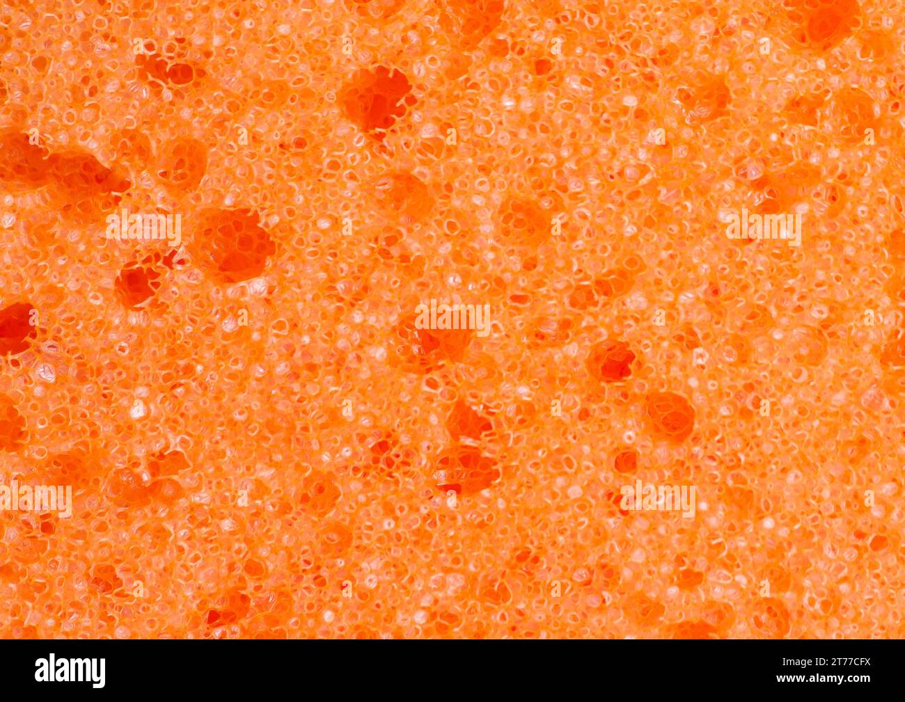 Orangefarbener Schwamm als Hintergrund Stockfoto