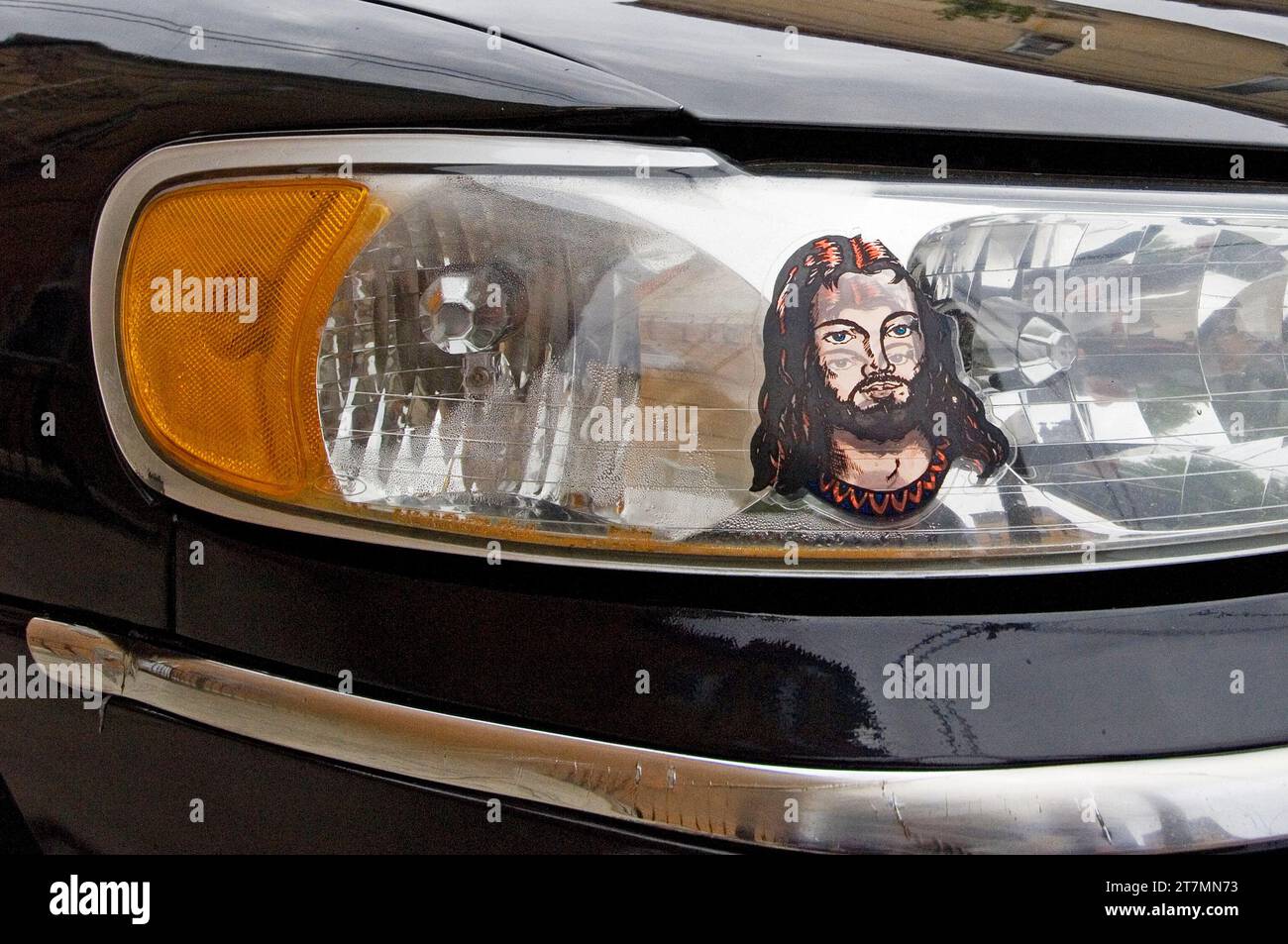 Autoscheinwerfer mit Jesusbild Stockfoto