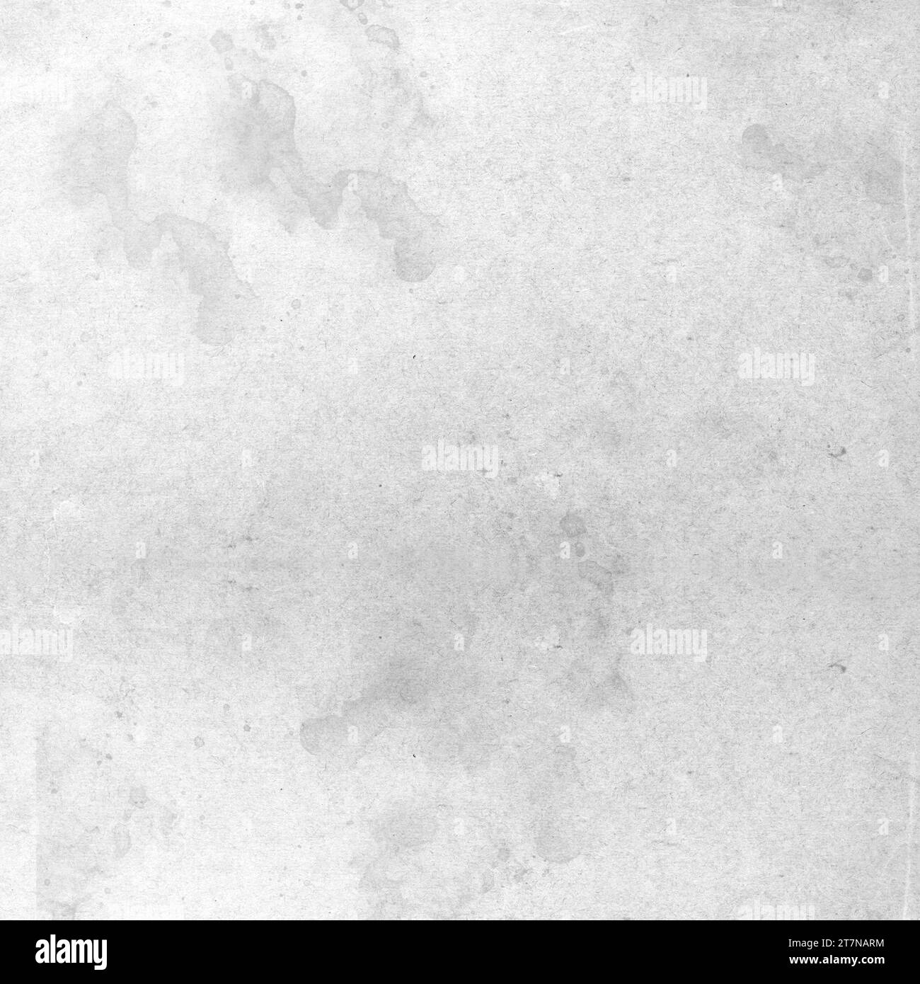 Graue Farbspritzer-Effekt-Textur auf weißem Papierhintergrund. Künstlerische Kulisse. Verschiedene Farbtropfen. Stockfoto