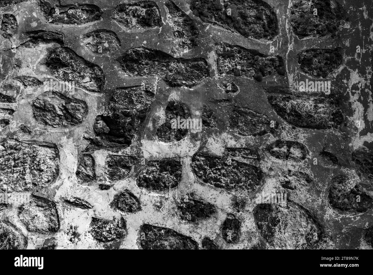Schwarz-weißer Hintergrund von einer alten Steinmauer Stockfoto Schwarz-weißer Hintergrund von einer alten Steinmauer Stockfoto