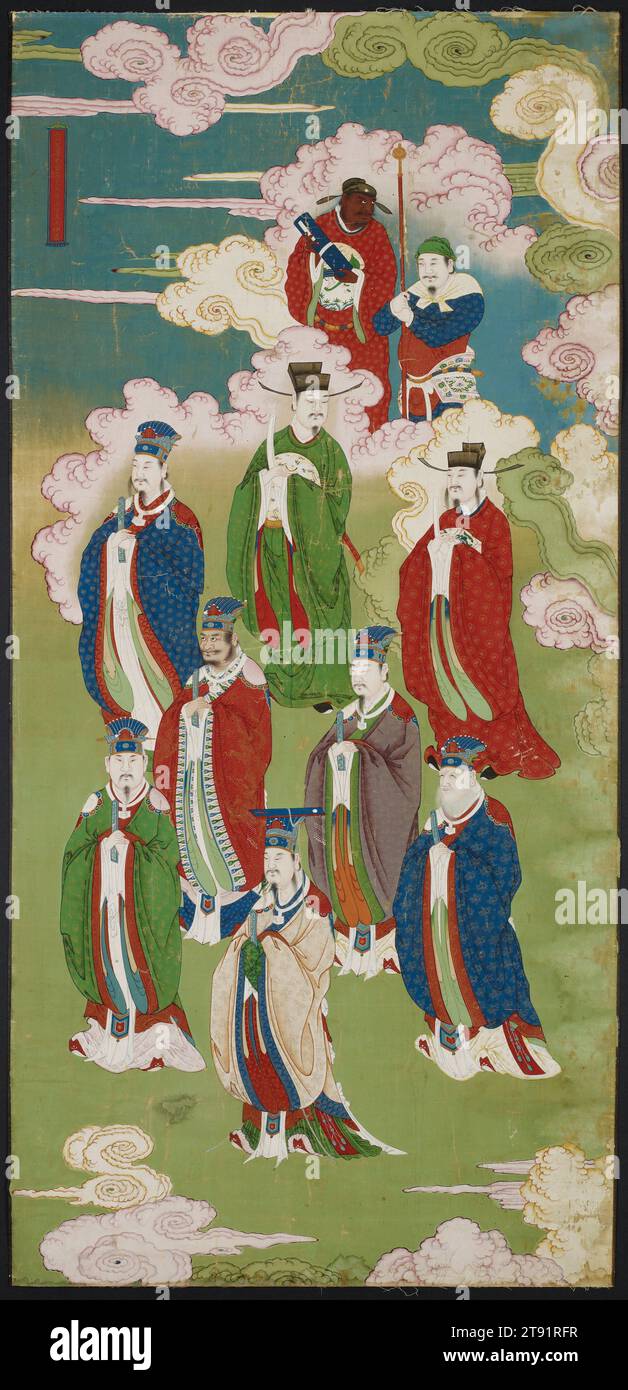 The Exalted Emperors and the Gods of the Five Directions, 16. Jahrhundert, 86 x 41 1/8 cm. (218,44 x 104,46 cm) (Bild, Sicht)90 x 45 1/16 Zoll (228,6 x 114,46 cm) (äußerer Rahmen), Tinte, Farben und Gold auf Seide, China, 16. Jahrhundert, diese Rolle trägt eine Inschrift, die die Figuren auf dem Gemälde als „die erhabenen Kaiser Tufu (Gott der Erde) und die Götter der fünf Richtungen“ identifiziert. Die Hauptfiguren sind alle in formellen Hofkleidern und Hüten gekleidet, die vom Himmel mit perfektem konfuzianischem Dekor herabsteigen Stockfoto