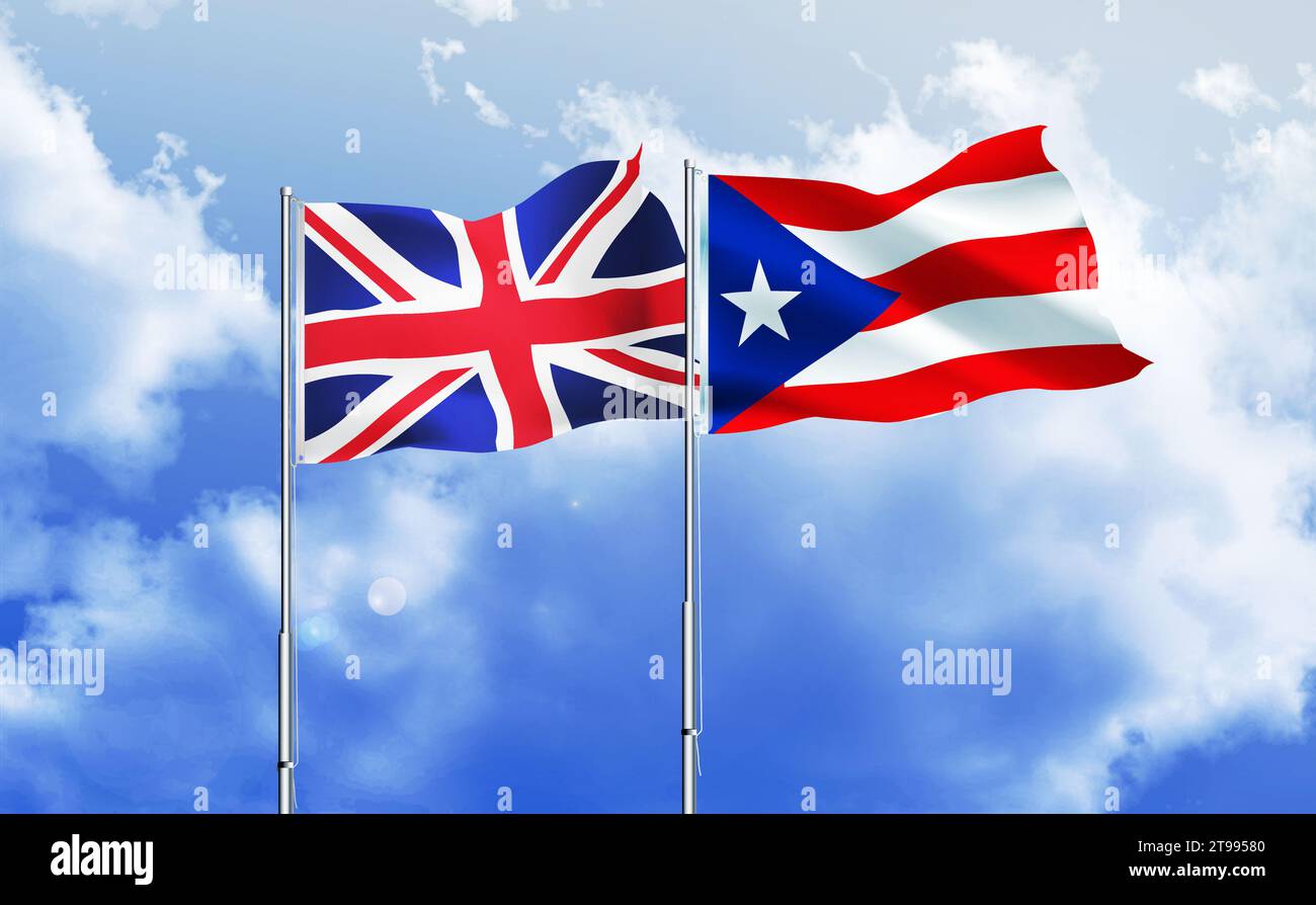 Puerto Rico, britische Fahnen winken zusammen gegen blauen Himmel Stockfoto