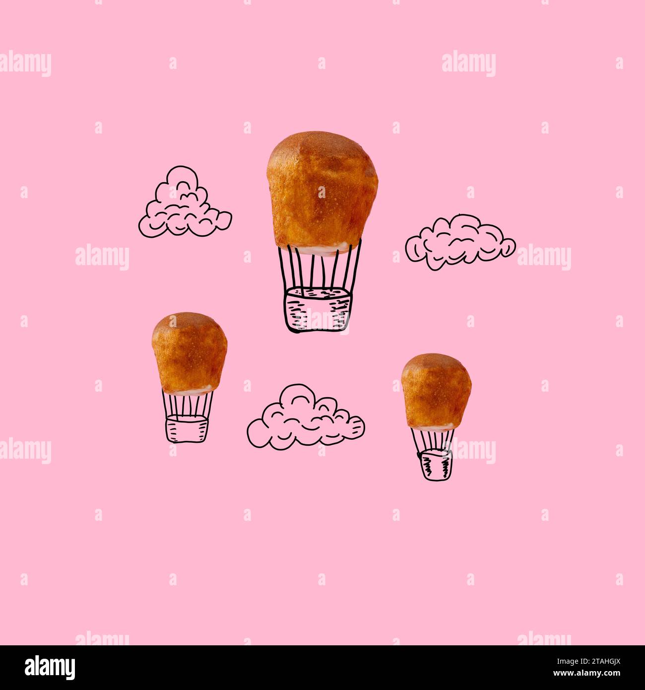 Cupcakes auf rosafarbenem Hintergrund wurden mit einem Ballon und Wolken vervollständigt Stockfoto