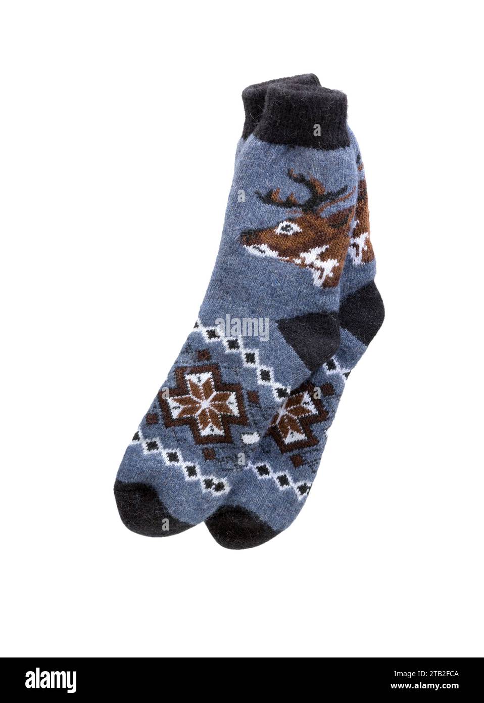 Socken mit Winterschmuck (Hirsch, Schneeflocken) isoliert auf weißem Hintergrund Stockfoto