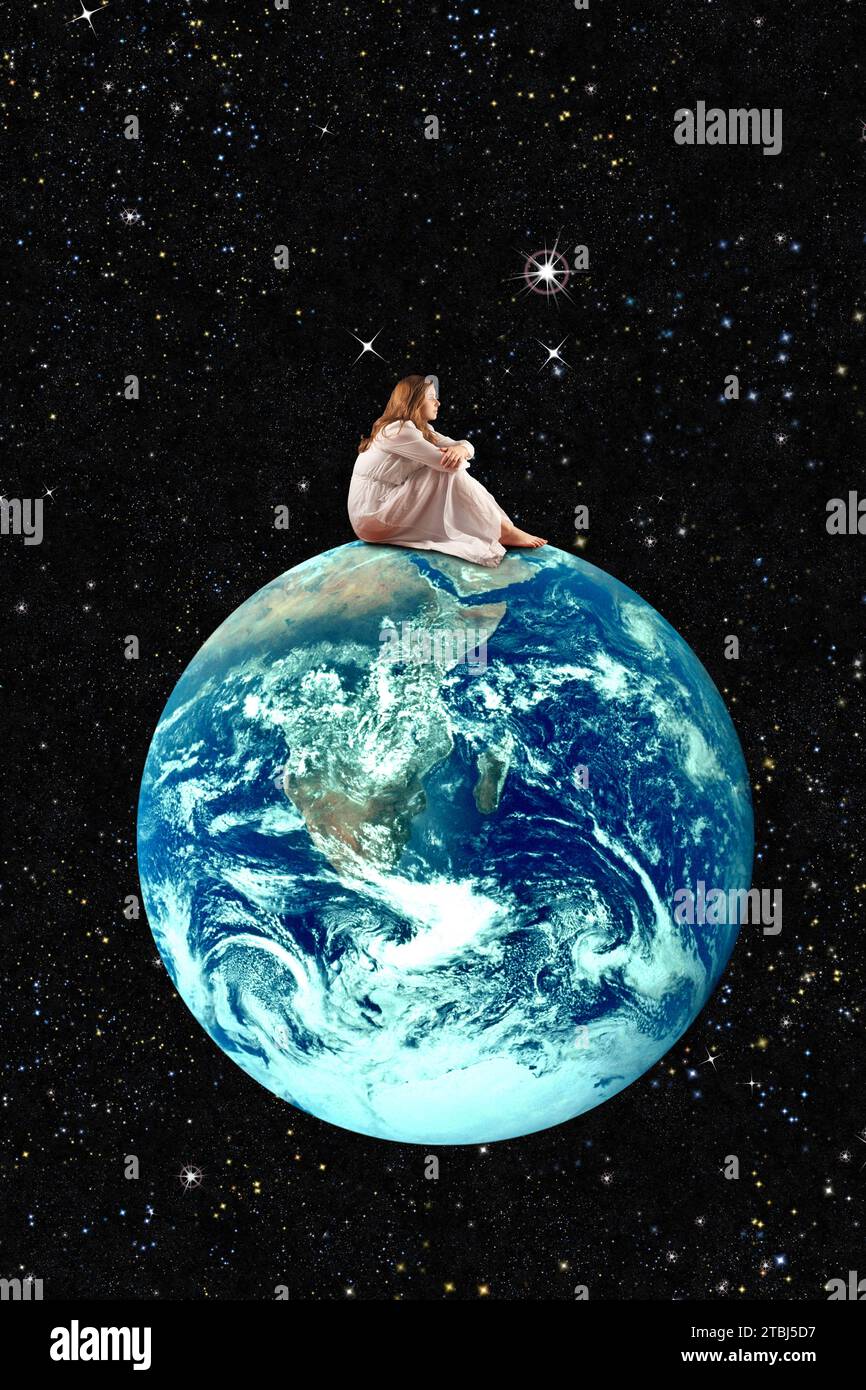 Ein junges Mädchen im Nachthemd, das auf dem Planeten Erde sitzt Stockfoto
