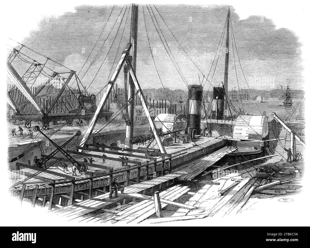 Laird's Graving Docks at Birkenhead: The Hibernia under Repair, 1861. In der Birkenhead-Eisenfabrik wurden die ersten Schiffe für die Vereinigten Staaten von Amerika gebaut, für den Indus, für den Nil, Euphrat, Tigris und andere wichtige Flüsse des Ostens. Die erste jemals für die Admiralität gebaute Dampffregatte wurde ebenfalls there...from 1829 gebaut bis zu diesem Zeitpunkt wurden in der obigen Anlage fast 300 Schiffe mit einer Bruttoraumzahl von mehr als 100.000 Tonnen gebaut. Heute sind hier zwei- bis dreitausend Mann beschäftigt, und eine große Zahl von Schiffen ist dabei Stockfoto