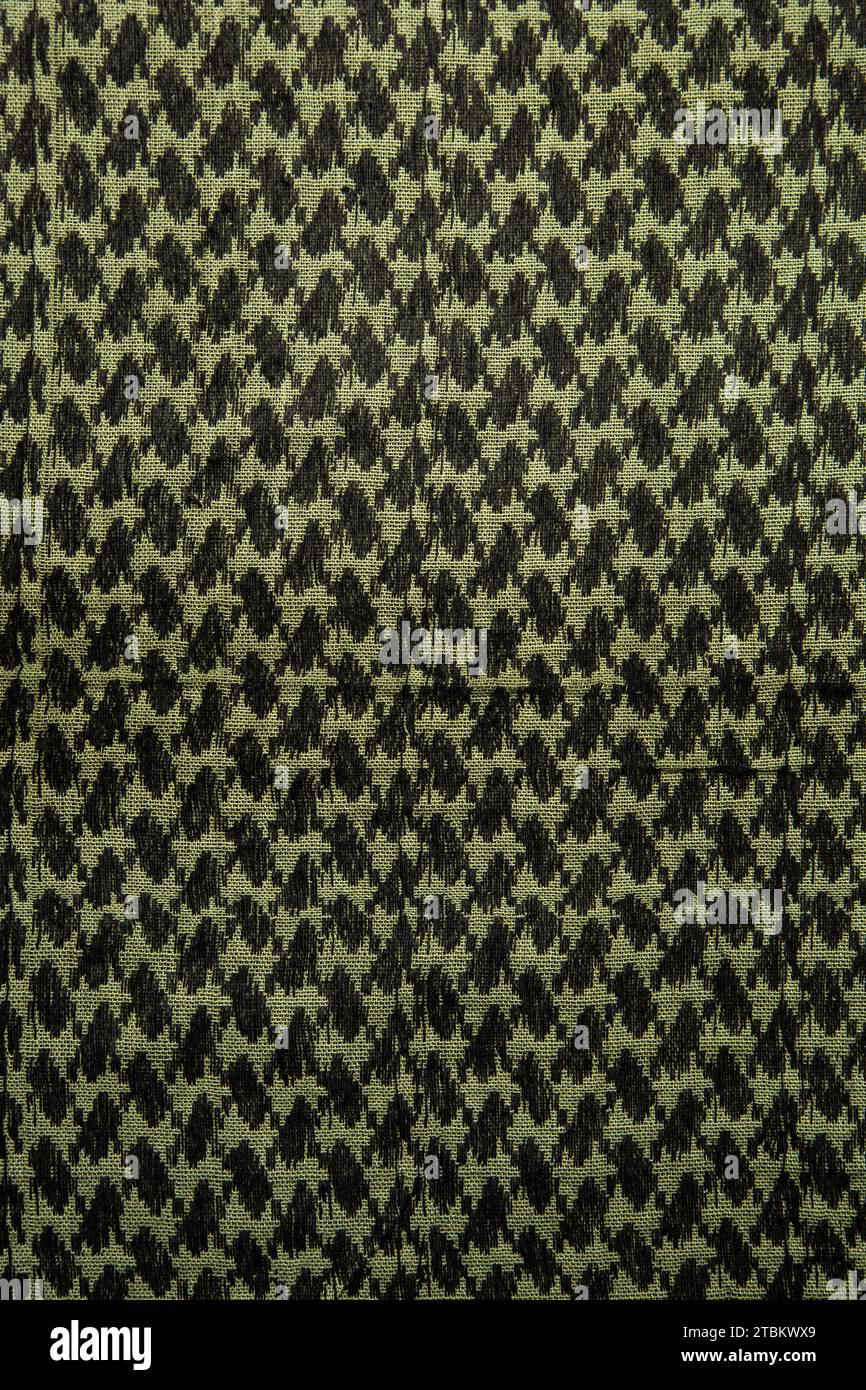 Keffieh Schal. Die Textur des traditionellen Baumwoll-symbolischen arabischen Schals. Khaki Hintergrund. Stockfoto