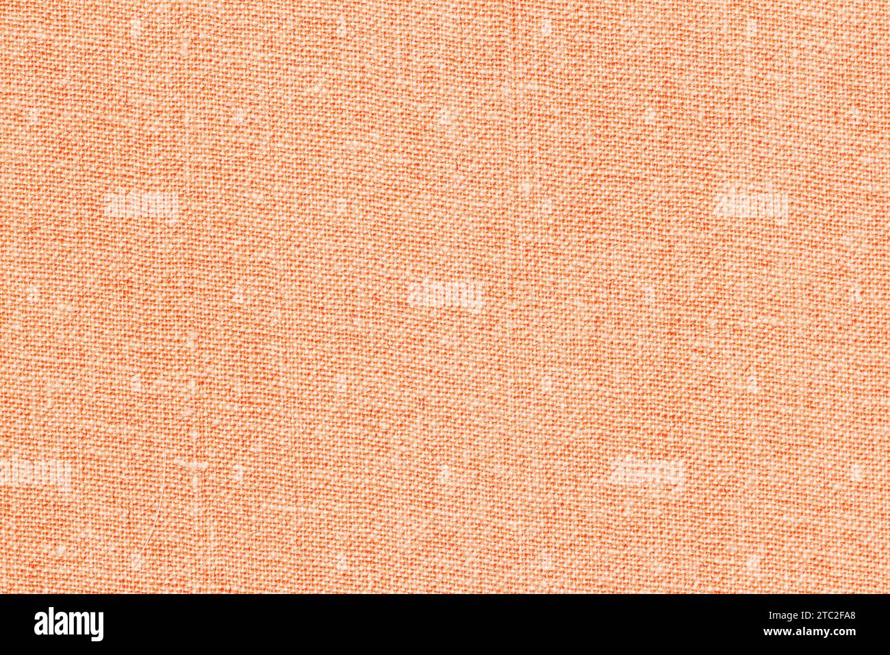 Stoffstruktur in pfirsichfarbener Farbe, natürlicher Hintergrund für Design Stockfoto