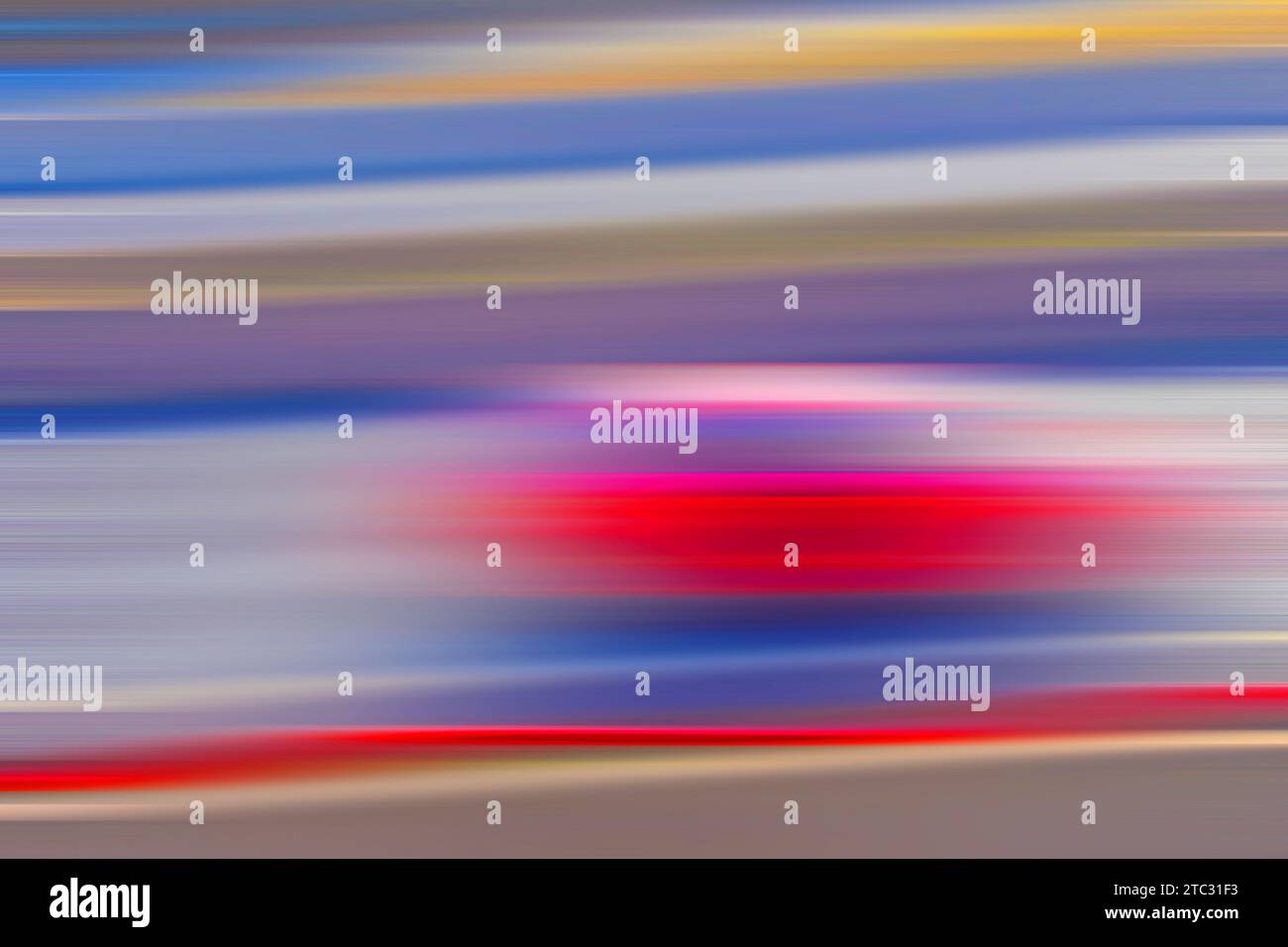 Rotes Auto, verschwommene Kunst. Stockfoto