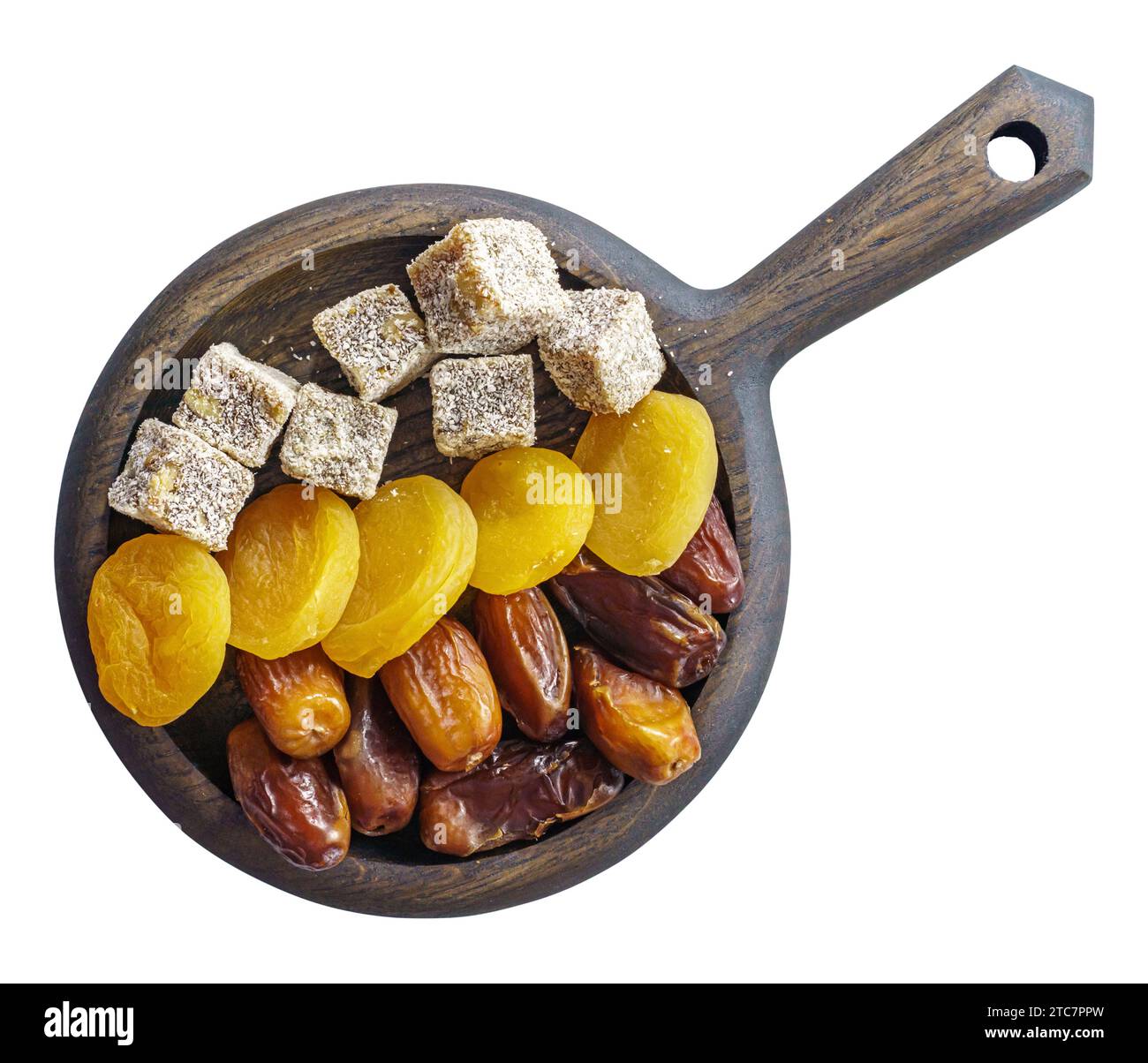 Türkische Delikatesse, getrocknete Aprikosen und Datteln auf Holzplatte isoliert oben Stockfoto