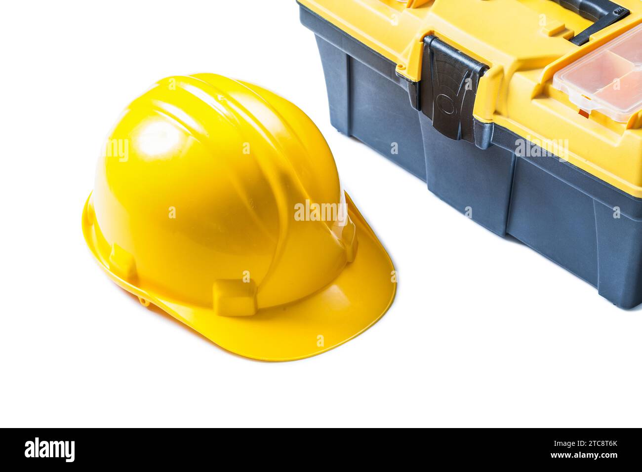 Gelber Helm und Werkzeugkasten aus nächster Nähe Stockfoto
