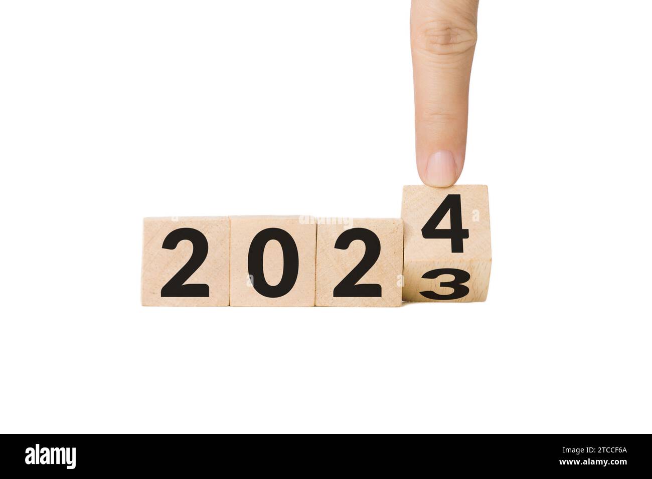 Hand-, Finger- und Holzwürfelblock von Jahr 2023 bis Jahr 2024. Beginn und Beginn des neuen Jahres 2024. Vorbereitung auf Neujahr und Leben Stockfoto