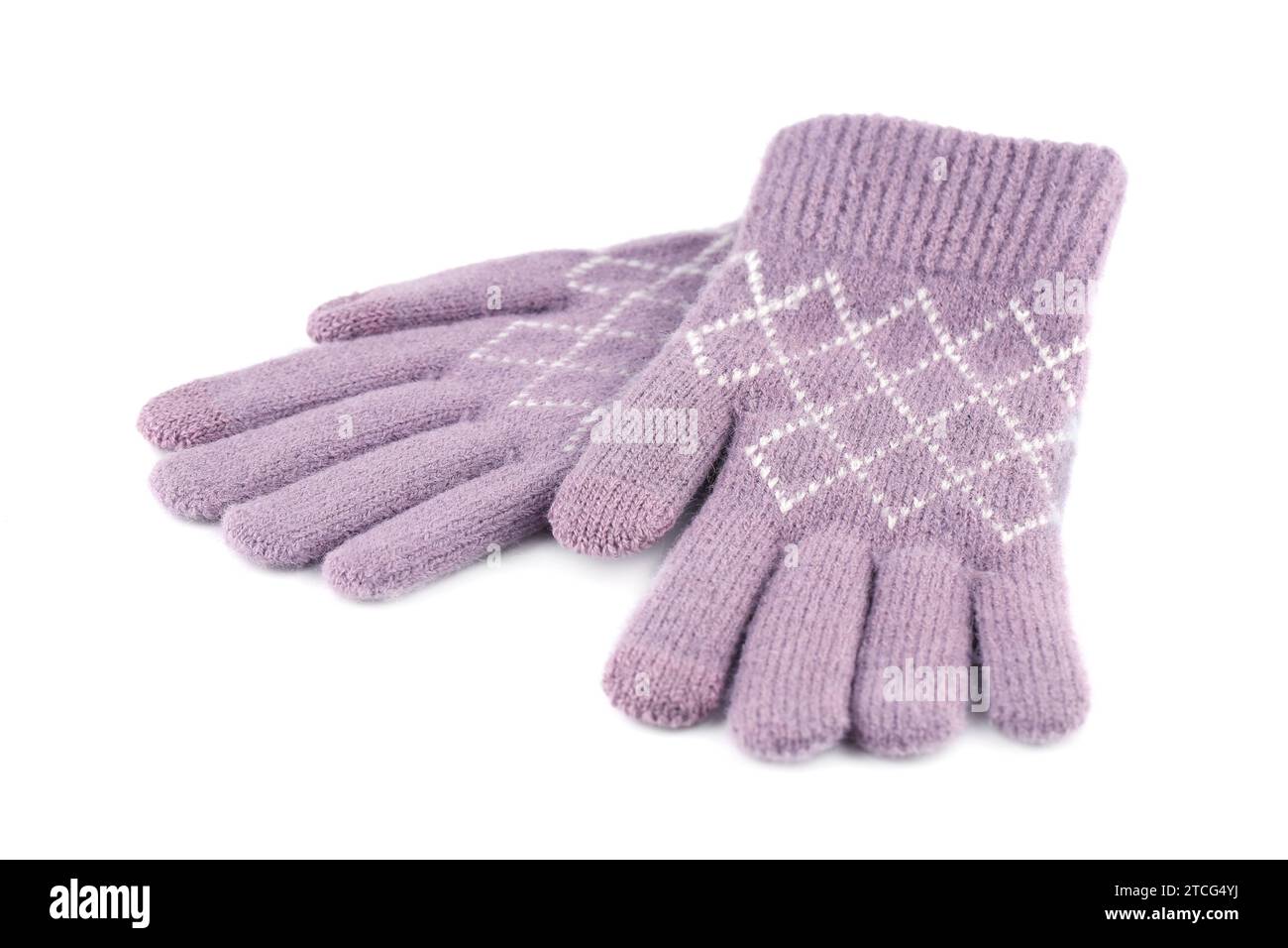 Rosafarbene Winterhandschuhe isoliert auf weißem Hintergrund. Stockfoto