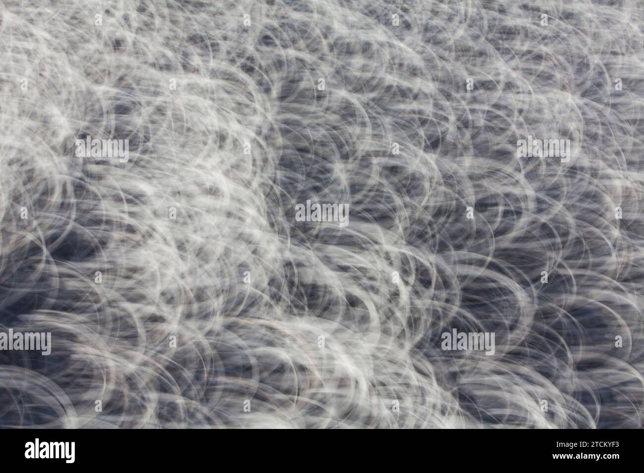 Kies, abstrakter Hintergrund, Wischeffekt, Glühlampenbelichtung Stockfoto