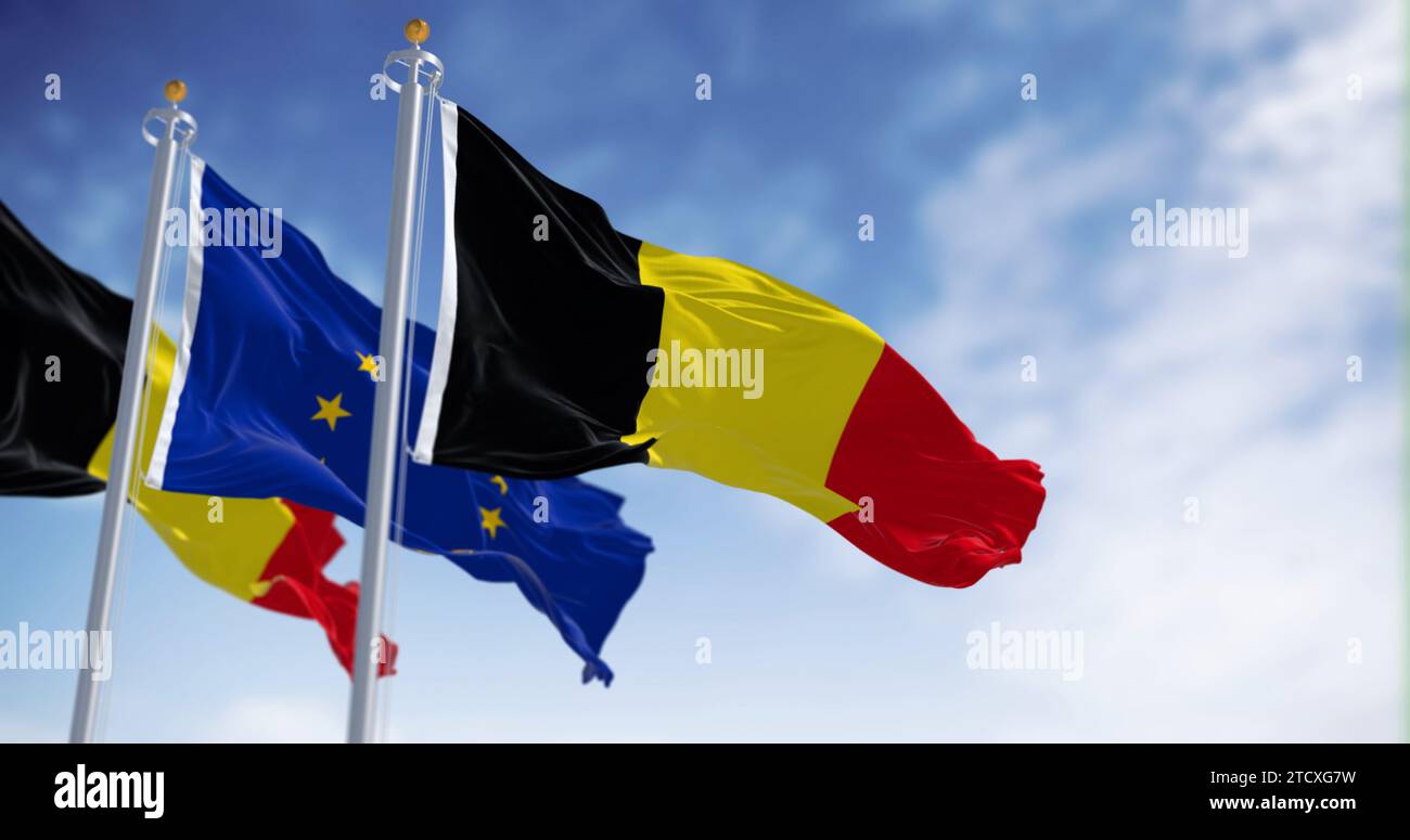 Belgische Nationalflaggen und Europäische Union-Flaggen, die im Wind winken. 3D-Darstellung. Flatterndes Gewebe. Selektiver Fokus Stockfoto