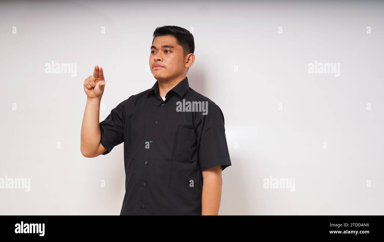Der asiatische Mann benutzt die Gebärdensprache mit der Hand. Lernen Sie die Gebärdensprache von Hand. ASL American Sign Language Stockfoto