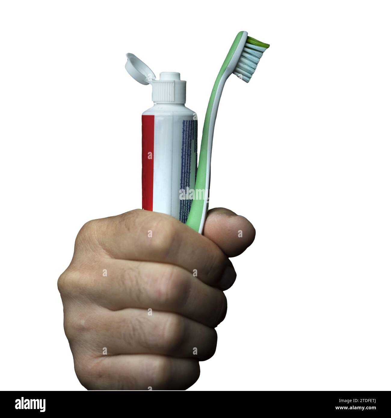 Ein Mann mit einer Zahnbürste und einer Tube Zahnpasta in der Hand Stockfoto