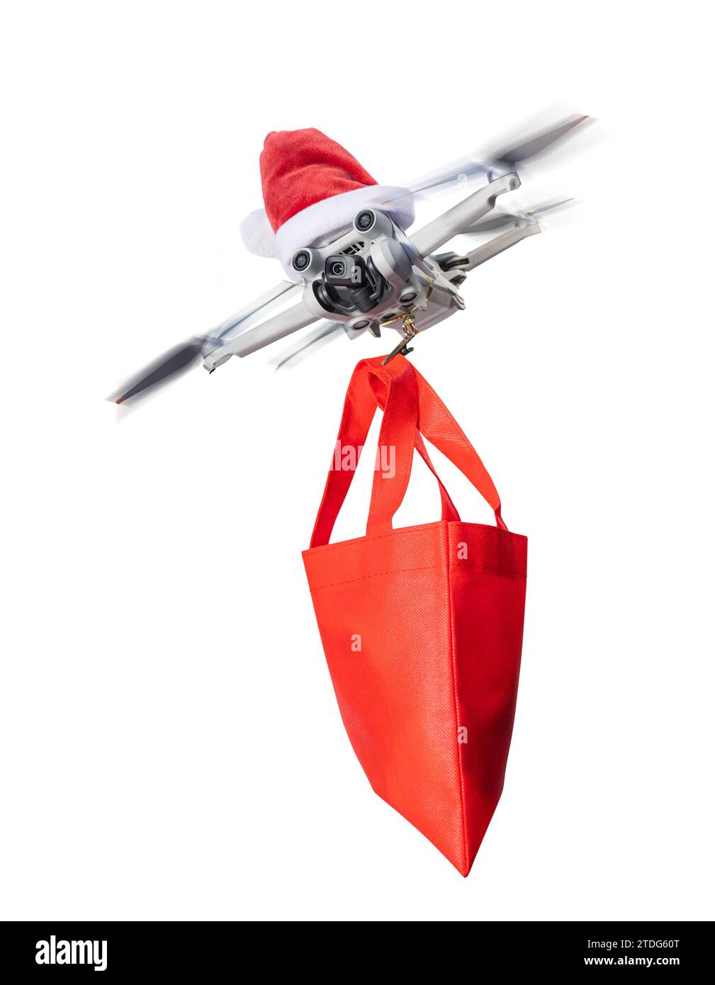 Drohnenkonzept trägt einen weihnachtsmann-Hut und hält ein eingewickeltes Geschenk für die Lieferung isoliert auf weißem Hintergrund. Stockfoto