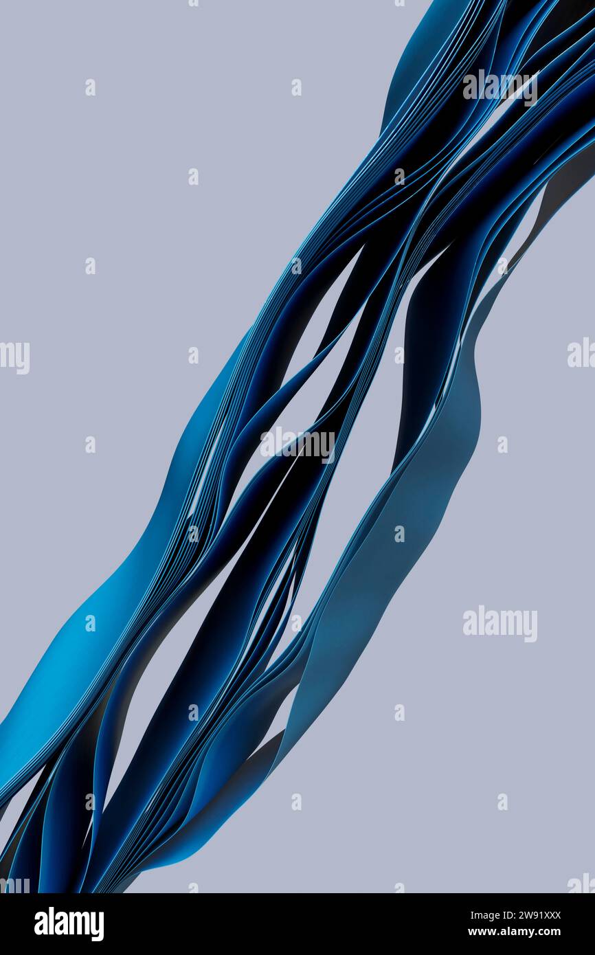 Schichten blauer Textilien, die vor grauem Hintergrund fließen Stockfoto