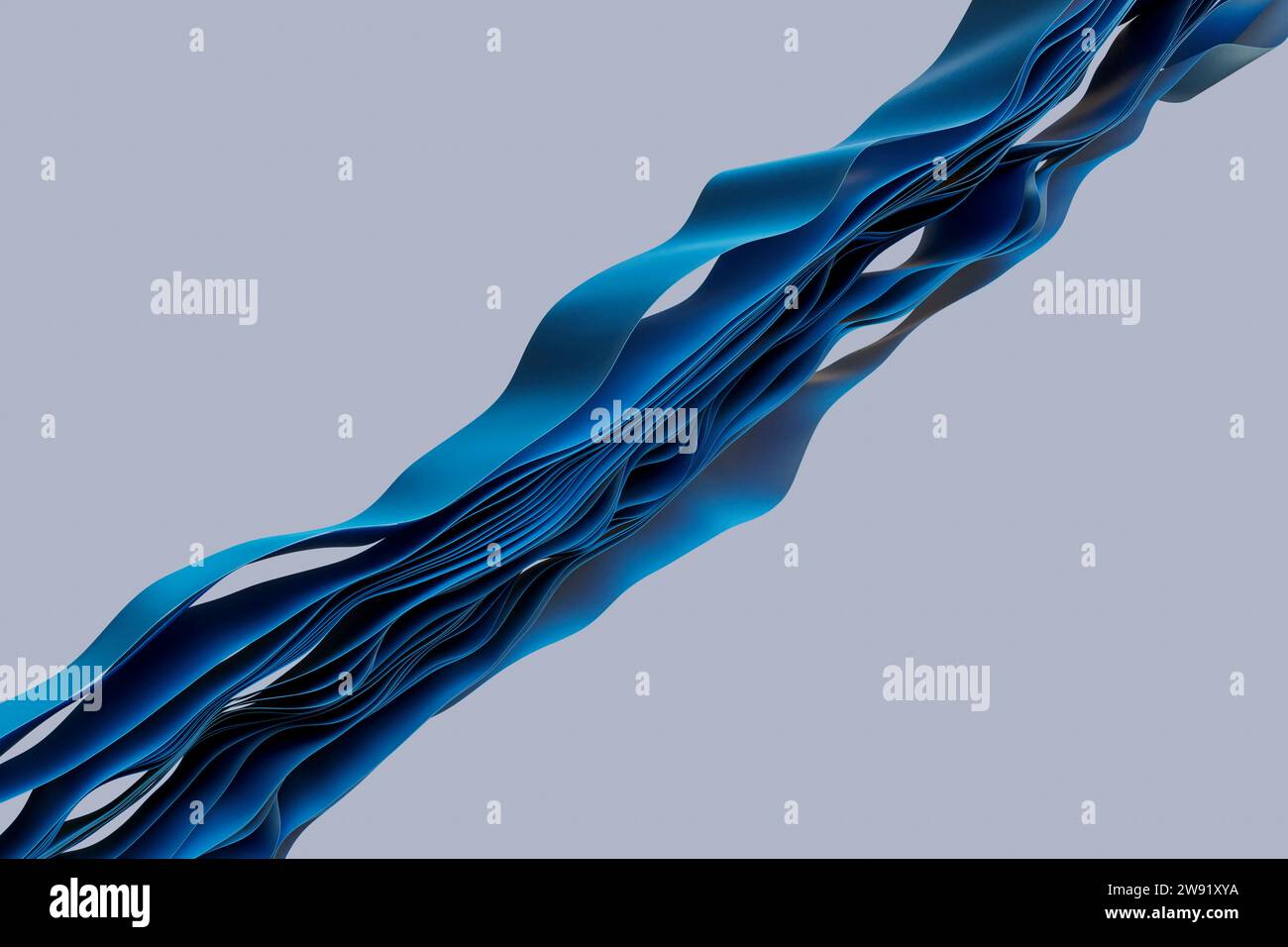 Schichten blauer Textilien, die im Wellenmuster vor grauem Hintergrund fließen Stockfoto