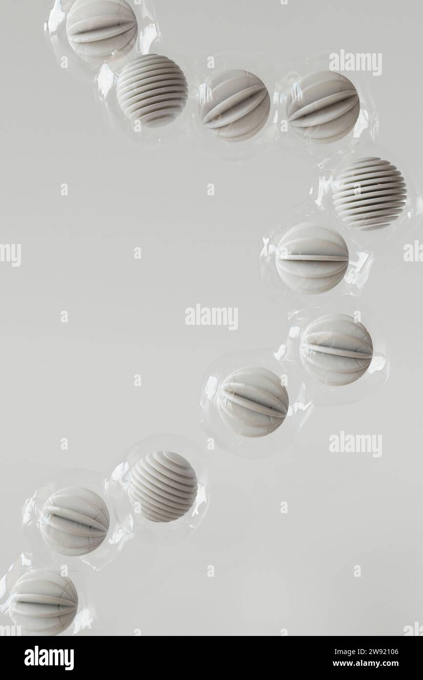 3D-Rendering einer Reihe von Kunststoffkugeln, die vor weißem Hintergrund schweben Stockfoto