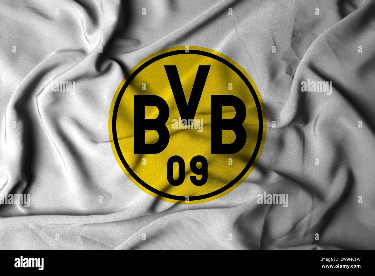 Selektiver Fokus des Borussia Dortmund Logos. Fußballverein Dortmund, Nordrhein-Westfalen. Mit fließender Stoffstruktur. 3D-Abbildung Stockfoto