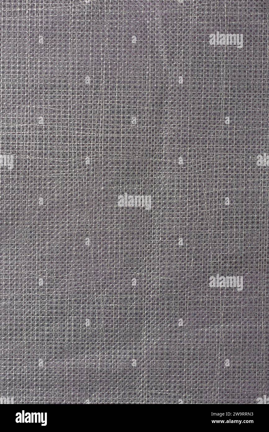 Nahaufnahme der grauen Vliesstoffoberfläche, abstrakt von waschbar, langlebig und direkt aus miteinander verklebten Fasern, Hintergrund Stockfoto