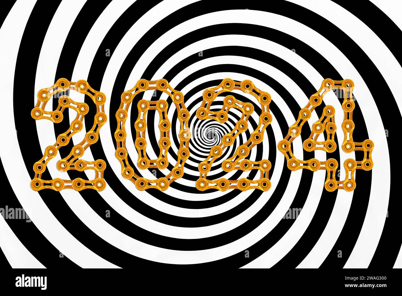Hypnose-Visualisierung mit dem Happy New Year 2024 aus goldenen Kettengliedern ist eine endlose Spirale Stockfoto