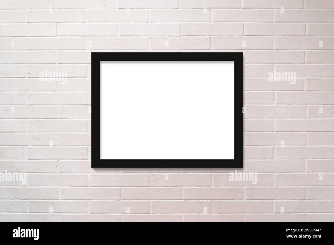 Vollbild-Nahaufnahme an einer weißen Ziegelwand mit einem horizontalen Bilderrahmen mit Kopierraum. Stockfoto