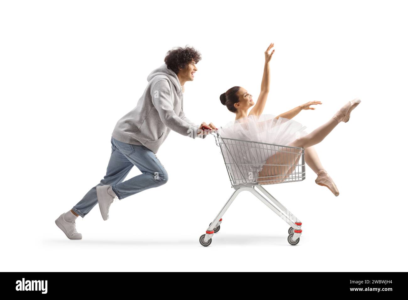 Der Typ schiebt eine Ballerina in einen Einkaufswagen, isoliert auf weißem Hintergrund Stockfoto