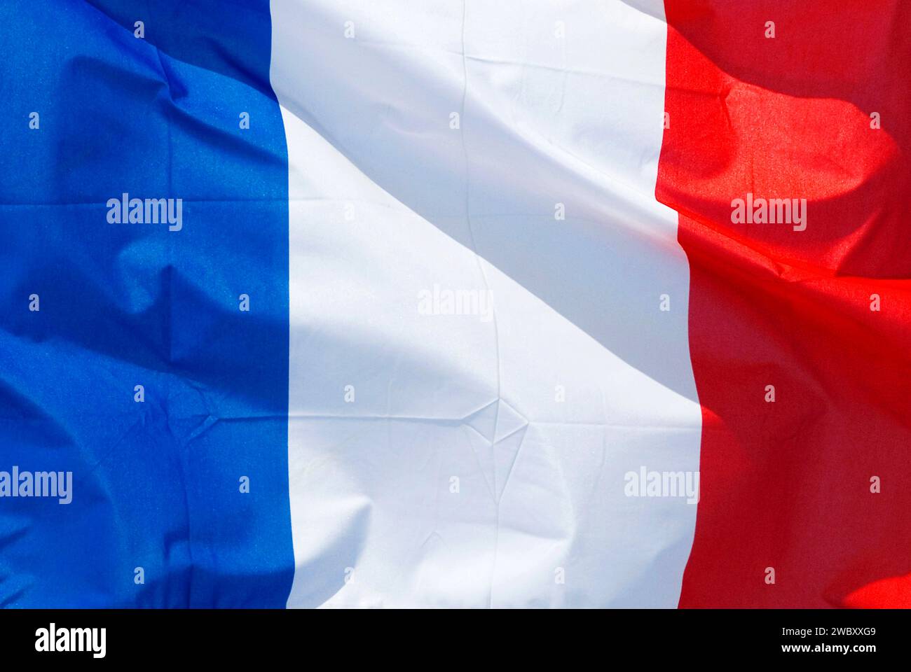 Nahaufnahme der französischen Nationalflagge, bleu, blanc, rouge, flatternd im Wind Stockfoto