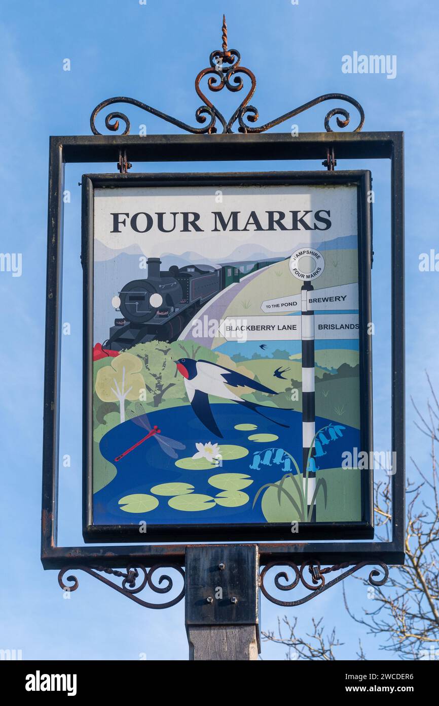 Four Marks Village Schild in Hampshire, England, Großbritannien Stockfoto