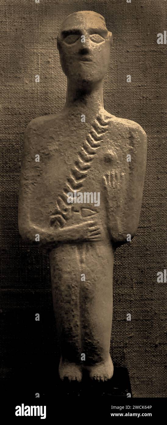 Die männliche Figur besitzt einen Flügel und einen kleinen Dreiecksdolch aus der frühen Kykladischen II. Periode 2800-2300 v. Chr. Museum Athen Stockfoto