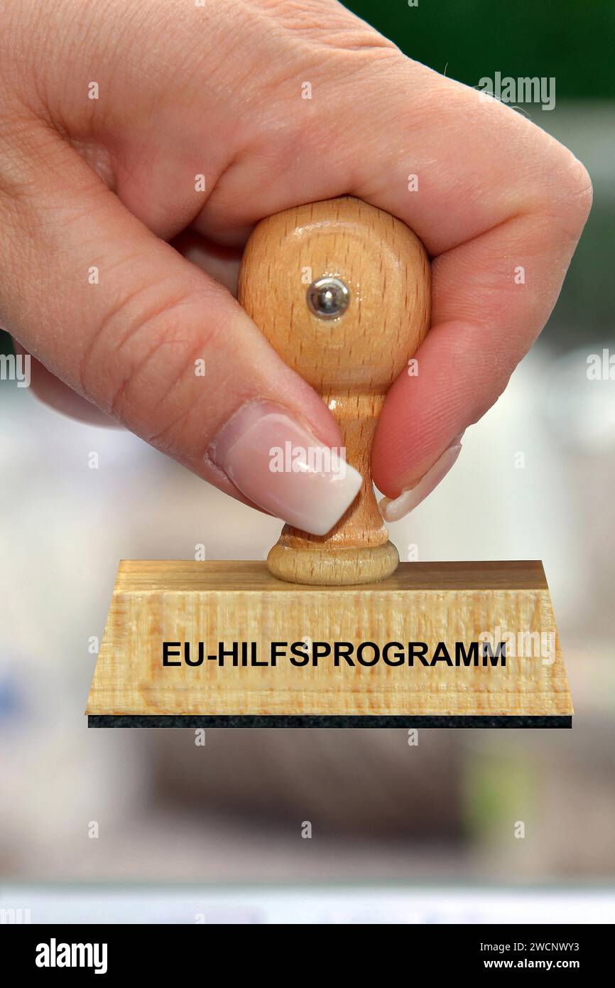 Symbolfoto, Frauenhand mit Stempel, Aufschrift: EU-Hilfsprogramm, Studio Stockfoto