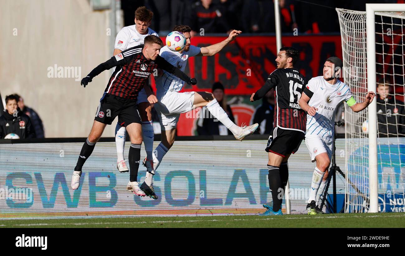 Nürnberg, Deutschland. Januar 2024. v. l. Florian Flick (1. FC Nürnberg, 6), Alexander Rossipal (FC Hansa Rostock, 21), Janik Bachmann (FC Hansa Rostock, 26), Ivan Marquez (1. FC Nürnberg, 15) und Damian Rossbach (FC Hansa Rostock, 4). 20.01.2024, Fussball, 2. Bundesliga, 1. FC N?rnberg - F.C. Hansa Rostock, GER, Nürnberg, Max-Morlock-Stadion, DFL-VORSCHRIFTEN VERBIETEN DIE VERWENDUNG VON FOTOGRAFIEN ALS BILDSEQUENZEN UND/ODER QUASI-VIDEO. Quelle: dpa/Alamy Live News Stockfoto