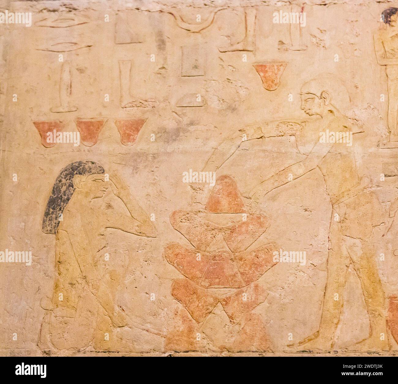 Ägypten, Sakkara, Grab von Ty, Bäckerei Szenen : Erwärmen Sie leere Töpfe, die als Mini-Öfen verwendet werden. Schützen Sie das Gesicht mit dem Arm vor Hitze. Stockfoto
