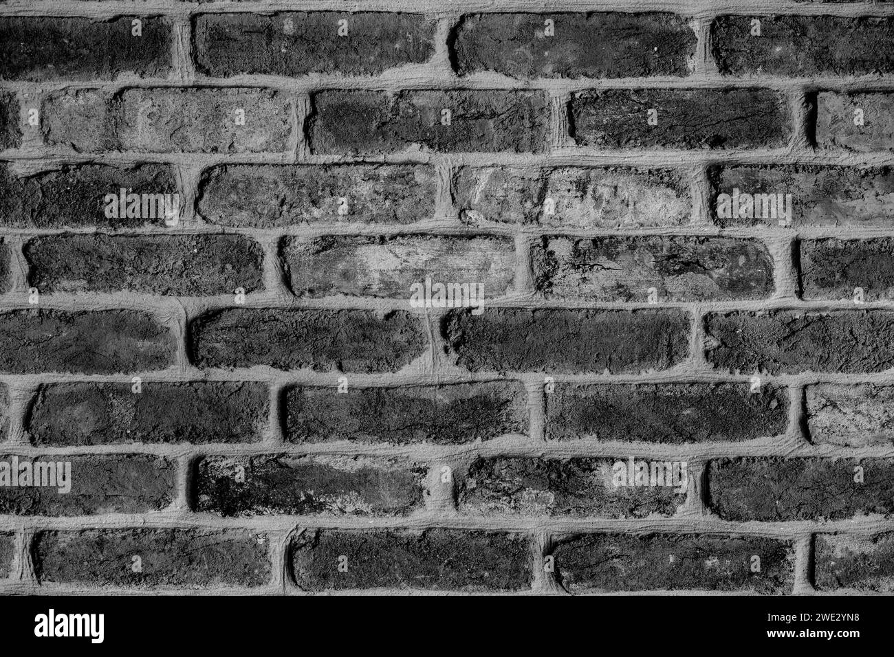 Backsteinwand orange rot kann als Tapete oder Hintergrund verwendet werden. Weiches Licht. Bestandstrend 2024. Stockfoto