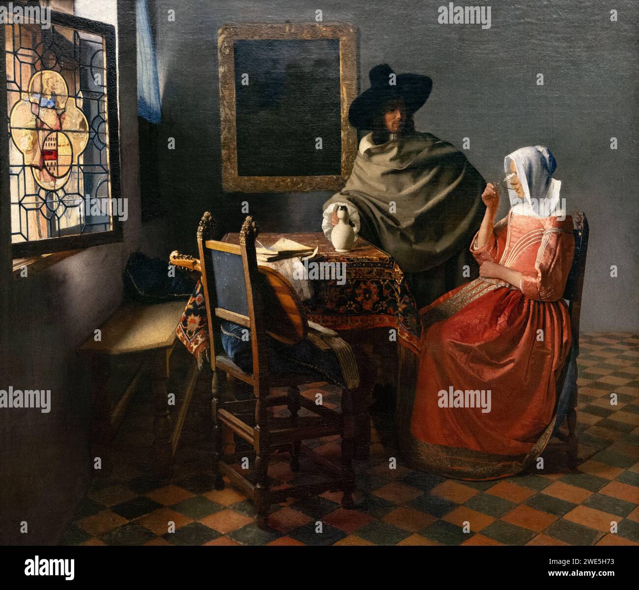 Johannes Vermeer Malerei; "das Glas des Weins" oder "das Weinglas" 1659 ; niederländisches Goldenes Zeitalter-Gemälde einer Frau und Verführung. Delfter Schule, Stockfoto