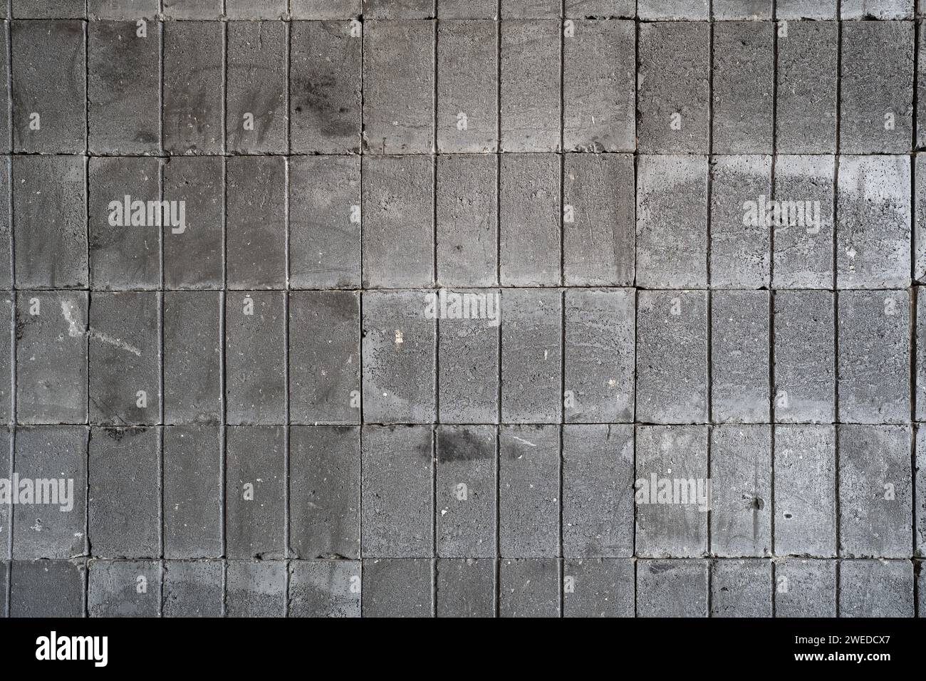Hintergrund der alten Betonblockwand Stockfoto